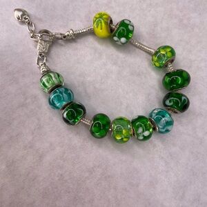 Pandora style bracelet 925 Silver with 12 green and yellow glass bead charms.
